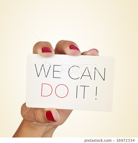 woman holds a signboard with the text we can do it 16972334