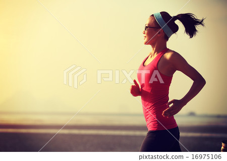 young fitness woman running at sunrise beach young fitness woman running at sunrise beach 16975106