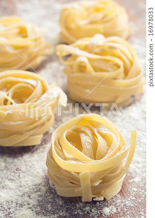 raw pasta and flour 16978033