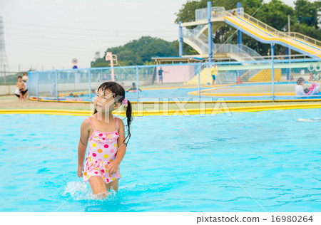 Girls playing in the pool 16980264