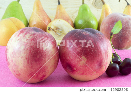 Couple of fresh peaches with fruit arrangement Couple of fresh peaches with fruit arrangement 16982298