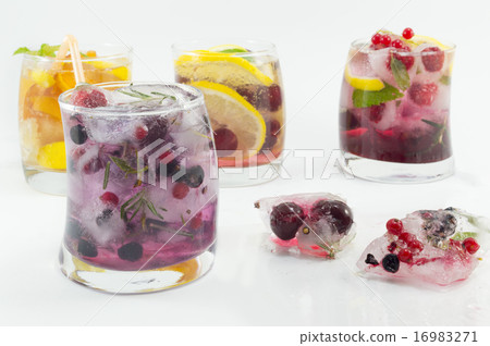 Summer refreshment next to frozen fruit  16983271