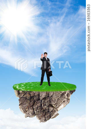Businessman on flying island Businessman on flying island 16983863