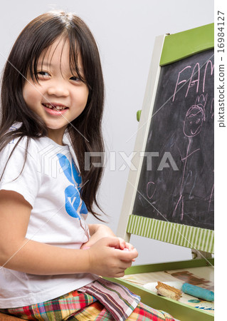 Little Girl With Blackboard Background 16984127