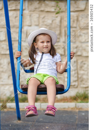 Child on a swing 16985432