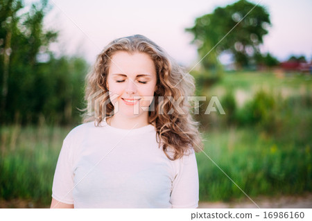 Portrait Of Beautiful Plus Size Young Woman In White Shirt Posin 16986160