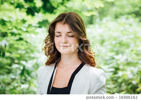 Portrait Of Young Happy Beauty Red Hair Girl In White Jacket In  16986162