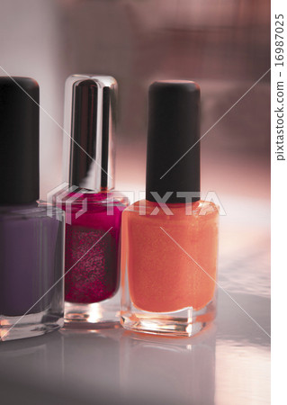 Close up of red, lilac and yellow nail polish Close up of red, lilac and yellow nail polish 16987025