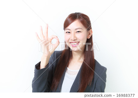 Female employee who issues OK sign Female employee who issues OK sign 16988377