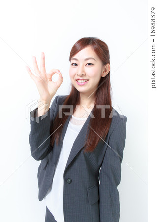 Female employee who issues OK sign Female employee who issues OK sign 16988379
