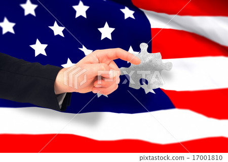 Composite image of hand of businessman in suit pointing 17001810