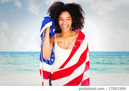 Composite image of pretty girl wrapped in american flag smiling Composite image of pretty girl wrapped in american flag smiling 17001906