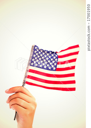 Composite image of hand waving american flag 17001950
