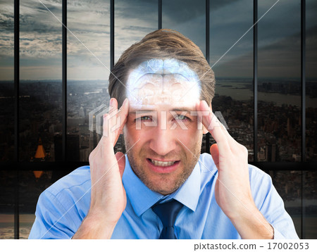 Composite image of young businessman with severe headache Composite image of young businessman with severe headache 17002053