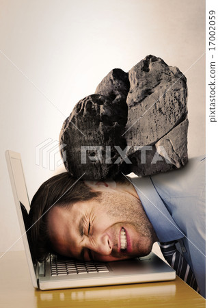 Composite image of businessman resting head on keyboard 17002059