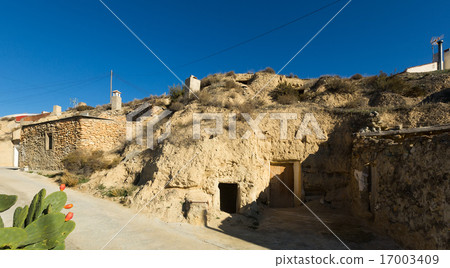 Village with dwellings houses built into rock 17003409