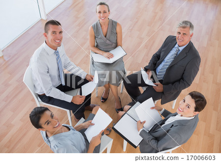 Business team sitting in circle and discussing Business team sitting in circle and discussing 17006603
