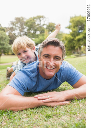 Happy father and his son smiling at camera Happy father and his son smiling at camera 17006931