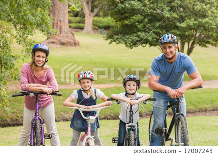 Happy family on their bike at the park 17007243