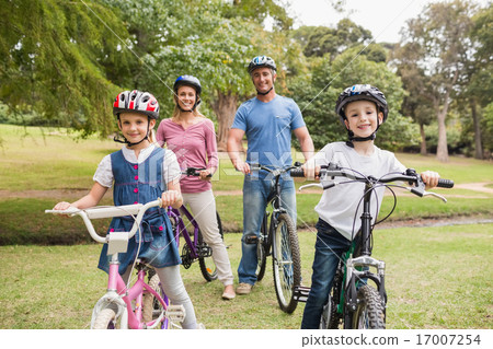 Happy family on their bike at the park 17007254