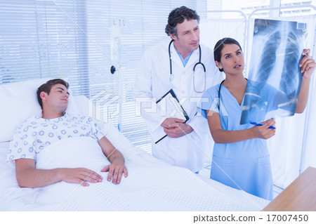 Doctors examining patients xray Doctors examining patients xray 17007450