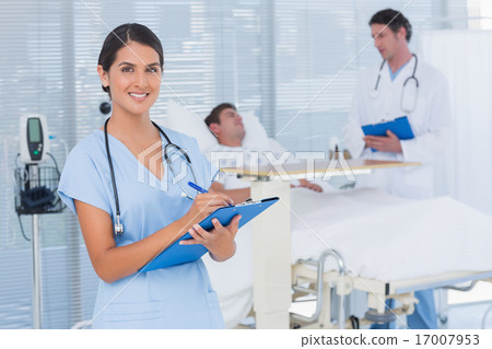 Doctors taking care of patient Doctors taking care of patient 17007953