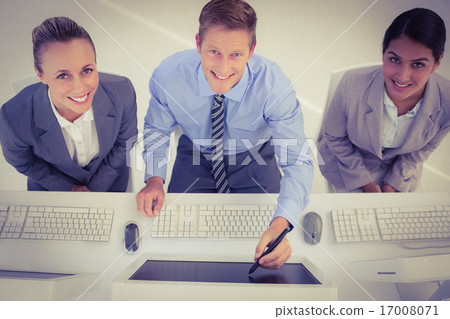 Businessman showing his screen to the team Businessman showing his screen to the team 17008071