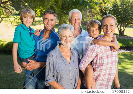 Happy family smiling at the camera Happy family smiling at the camera 17008322