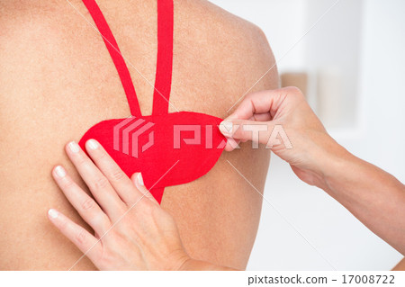 Doctor examining her patient back 17008722