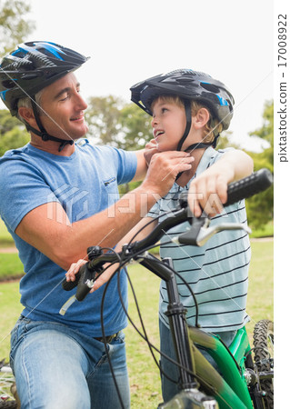 Father on a bike with his son 17008922