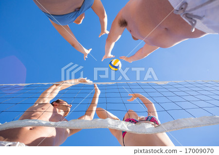 Group of friends playing volleyball Group of friends playing volleyball 17009070