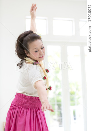 A woman dancing hula 17010072