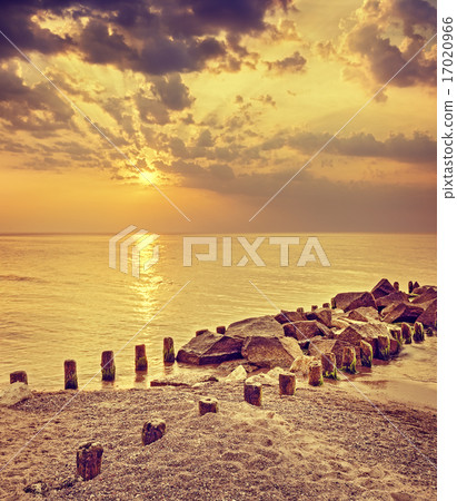 Retro toned dramatic sunset over beach. Retro toned dramatic sunset over beach. 17020966