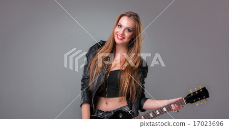 Beautiful girl playing guitar Beautiful girl playing guitar 17023696