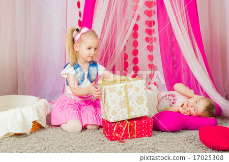 Little girl in a fashionable pink skirt 17025308