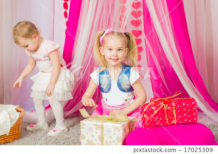 Little girl in a fashionable pink skirt Little girl in a fashionable pink skirt 17025309