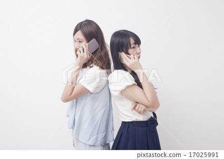 Two women who call by cell phone Two women who call by cell phone 17025991