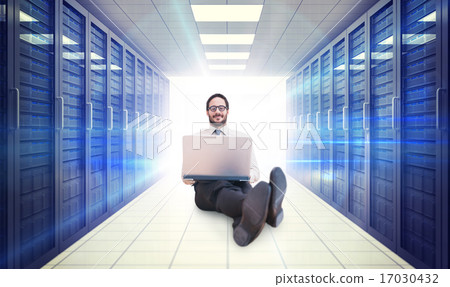 Composite image of businessman using laptop Composite image of businessman using laptop 17030432