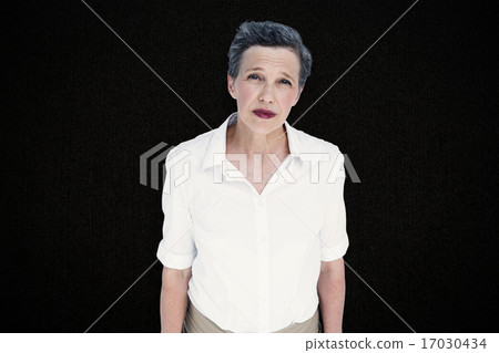 Composite image of serious businesswoman 17030434