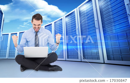 Composite image of businessman sitting with his laptop cheering Composite image of businessman sitting with his laptop cheering 17030847