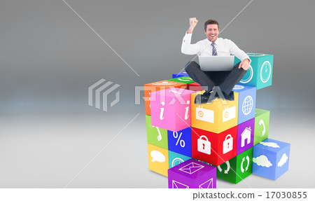 Composite image of businessman using laptop and cheering Composite image of businessman using laptop and cheering 17030855