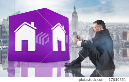 Composite image of mature businessman sitting using tablet Composite image of mature businessman sitting using tablet 17030861