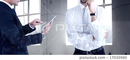 Composite image of portrait of a businessman with glasses thinki 17030980