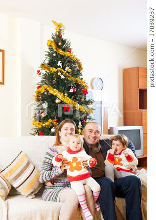 Family on sofa at christmas Family on sofa at christmas 17039237