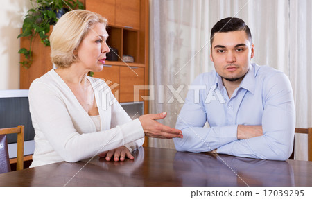 woman and young fiance signing marriage settlement 17039295