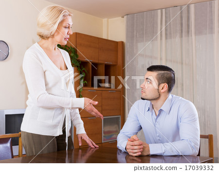 woman and young fiance signing marriage settlement 17039332