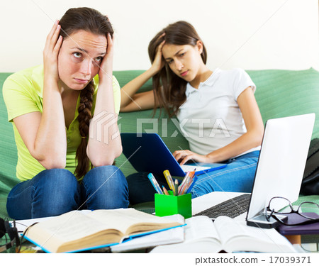 Two melancholy female students 17039371