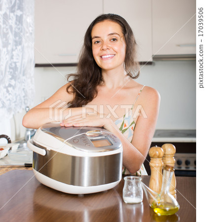 Housewife cooking with multi cooker Housewife cooking with multi cooker 17039506