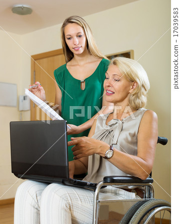 Happy woman in wheelchair Happy woman in wheelchair 17039583