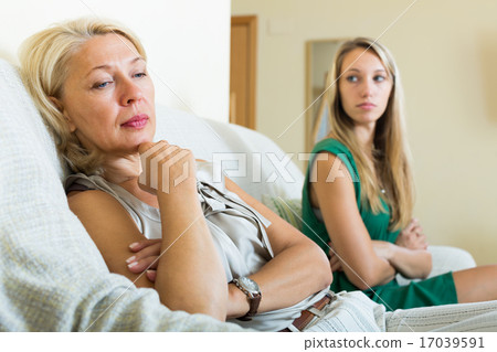 adult daughter and upset mother having conflict 17039591